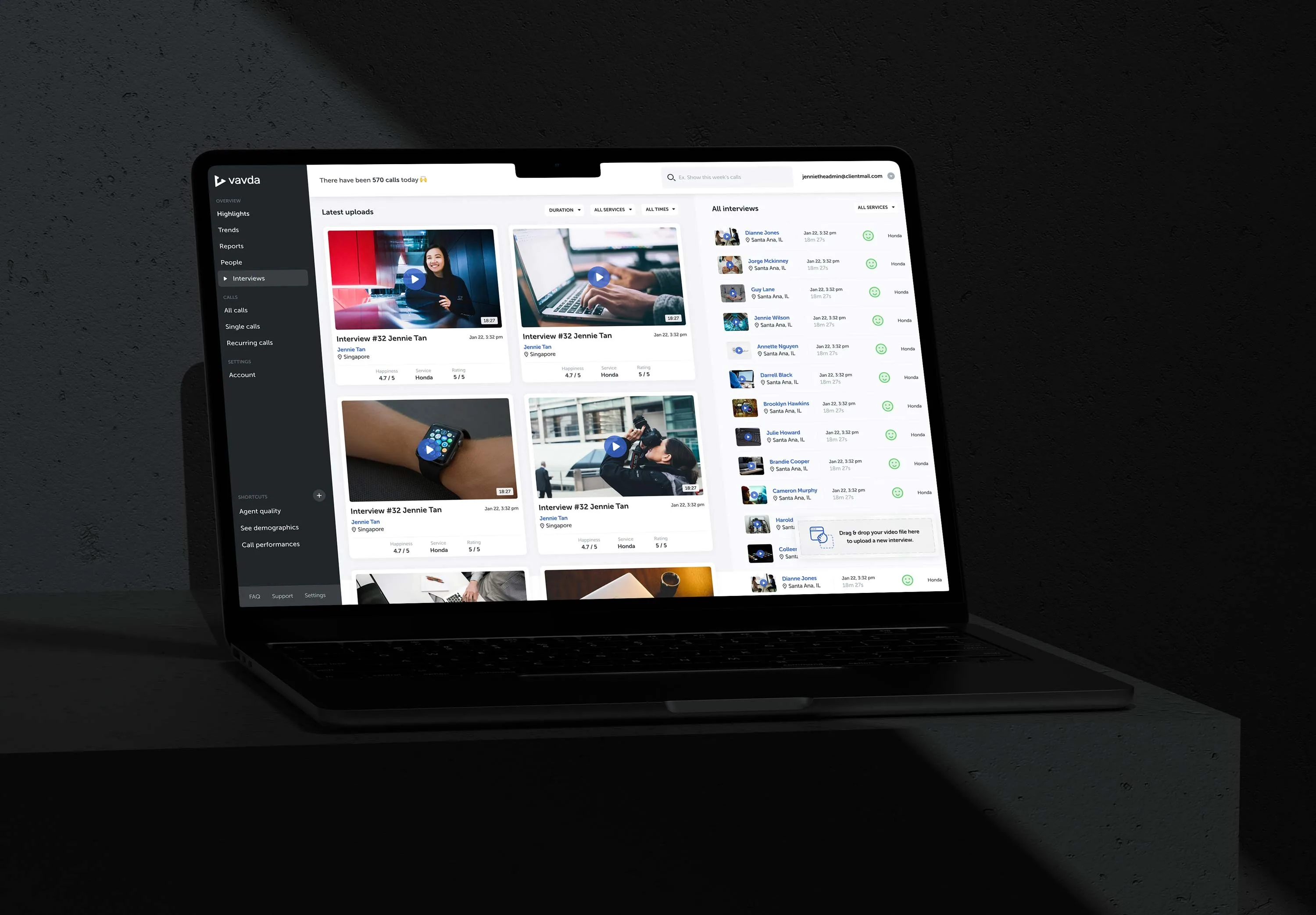 Vavda interviews workspace on a laptop. The main area shows uploaded interview cards with video thumbnails, locations, timestamps, happiness, service, and rating metadata, while a right column lists all interviews with playback icons, sentiment markers, and upload affordances.